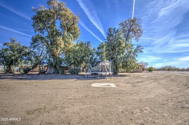 view of yard with a trampoline