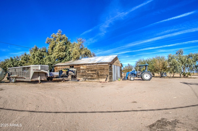 view of side of home with an outbuilding