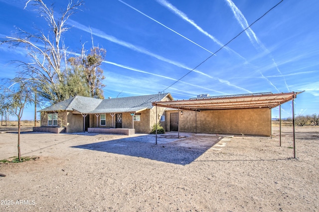 view of front of house with a carport