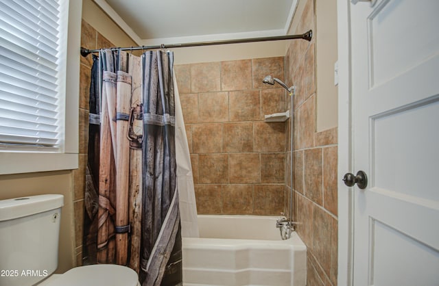 bathroom with shower / bath combo and toilet