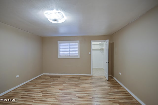 spare room with light wood-type flooring