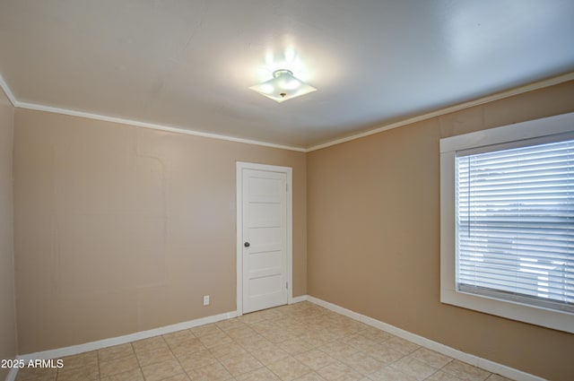 unfurnished room with crown molding