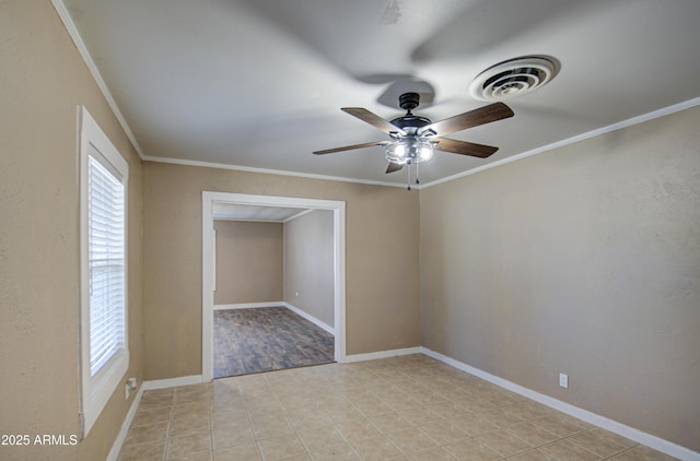 tiled spare room with crown molding and ceiling fan