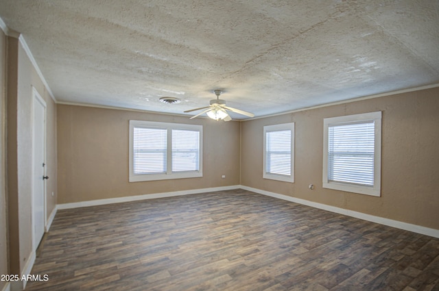 unfurnished room with dark wood-type flooring, ceiling fan, crown molding, and a wealth of natural light