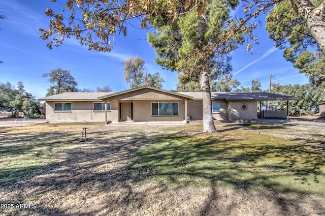 ranch-style home featuring a jacuzzi, a patio area, and a front yard