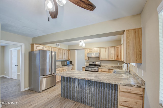 kitchen with light brown cabinetry, sink, stainless steel appliances, and ceiling fan