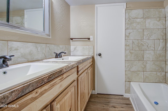 bathroom featuring hardwood / wood-style flooring and vanity