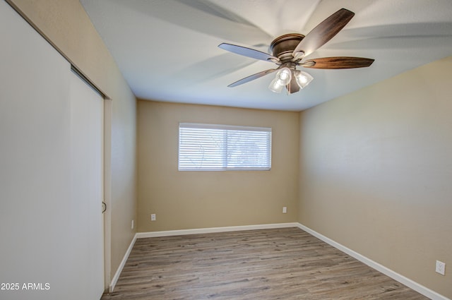 unfurnished room with light hardwood / wood-style floors and ceiling fan