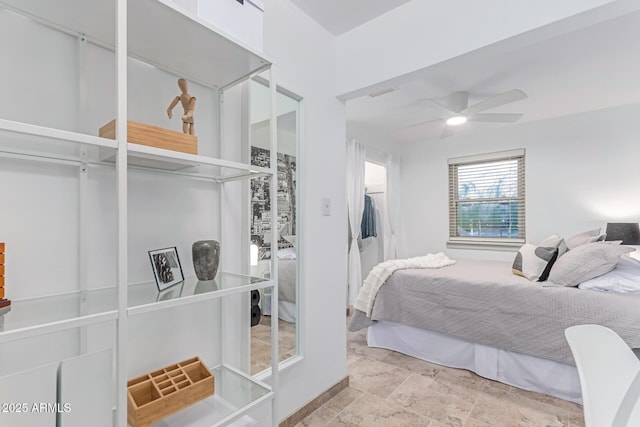 bedroom featuring a ceiling fan and visible vents