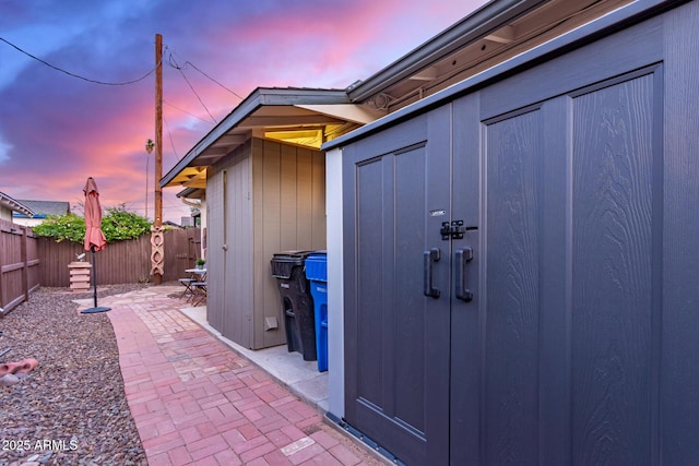 view of shed with a fenced backyard