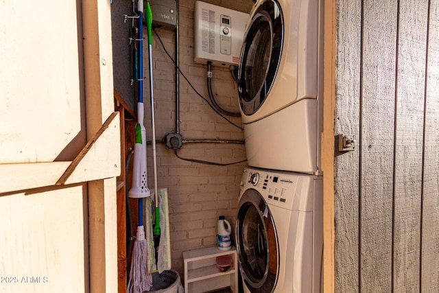 laundry room with laundry area and stacked washing maching and dryer