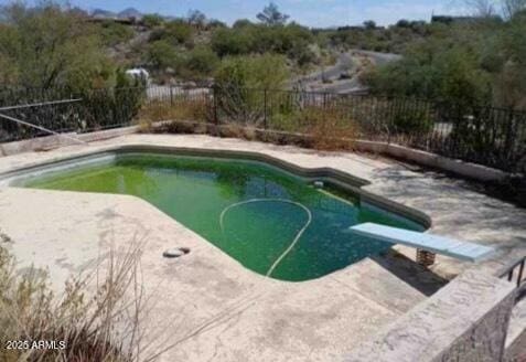 view of swimming pool with a patio, a fenced backyard, and a fenced in pool