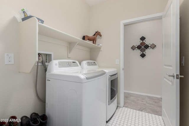 laundry area with independent washer and dryer