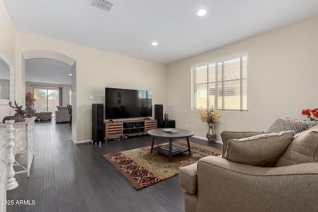 living room with dark hardwood / wood-style floors