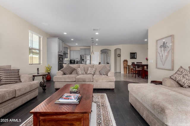 living room with dark hardwood / wood-style floors