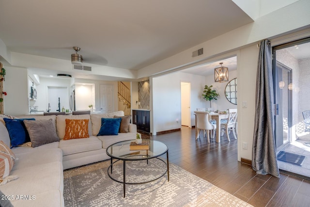 living room featuring an inviting chandelier