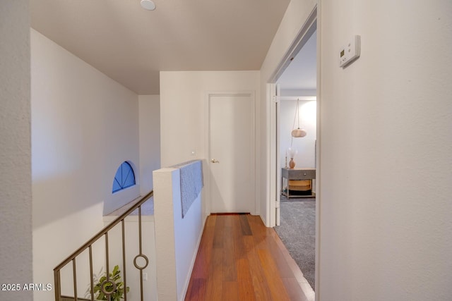 corridor with wood-type flooring