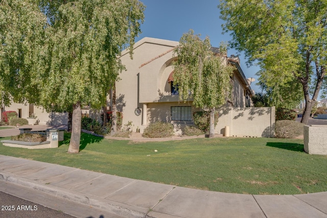 view of front of house with a front lawn