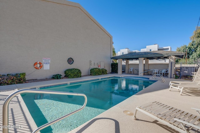 view of pool with a patio and a pergola