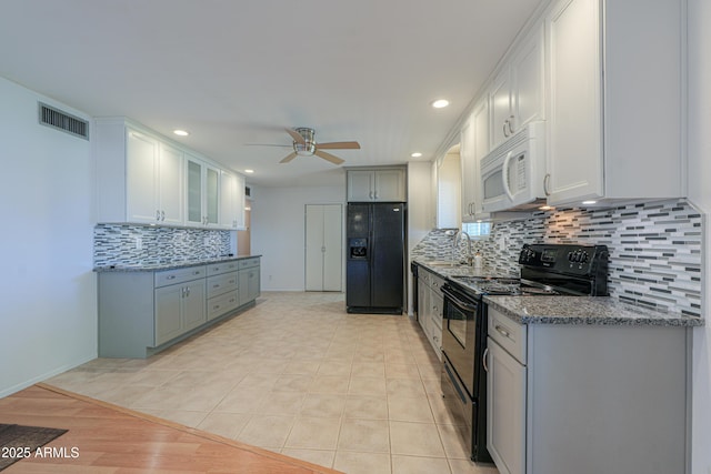 kitchen with recessed lighting, ceiling fan, tasteful backsplash, black appliances, and visible vents