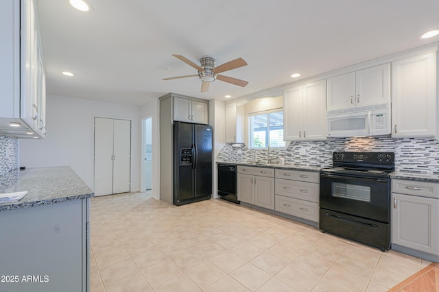 kitchen featuring dark stone counters, tasteful backsplash, black appliances, a ceiling fan, and gray cabinetry