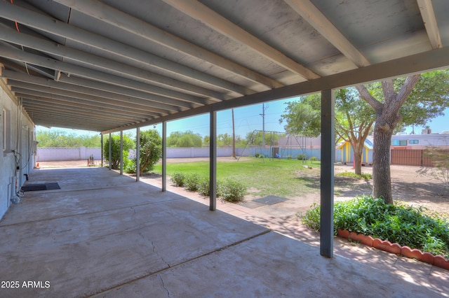 view of patio / terrace with a fenced backyard and an outdoor structure