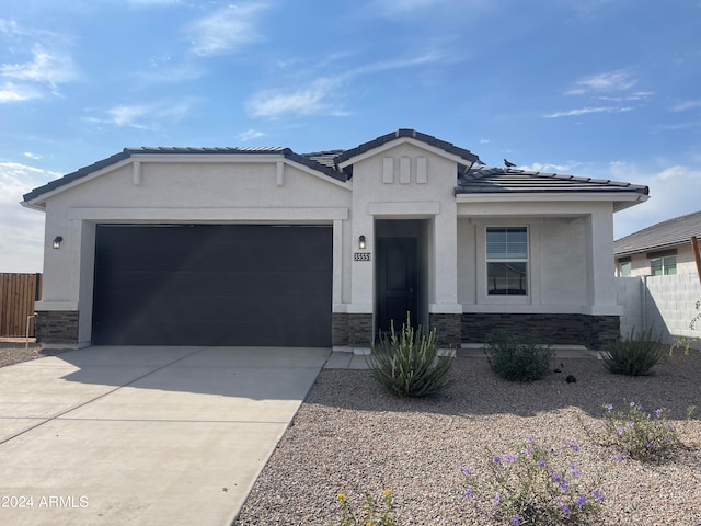 view of front of home with a garage