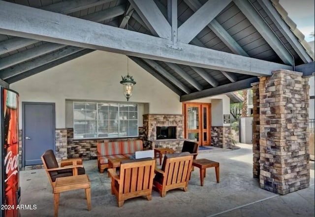 view of patio with an outdoor stone fireplace