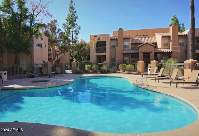 view of pool featuring a patio area