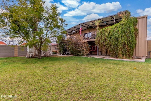 view of yard with fence and a wooden deck