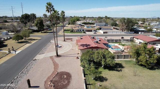 birds eye view of property with a residential view