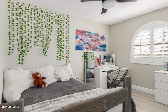 bedroom with light wood-type flooring, baseboards, and a ceiling fan