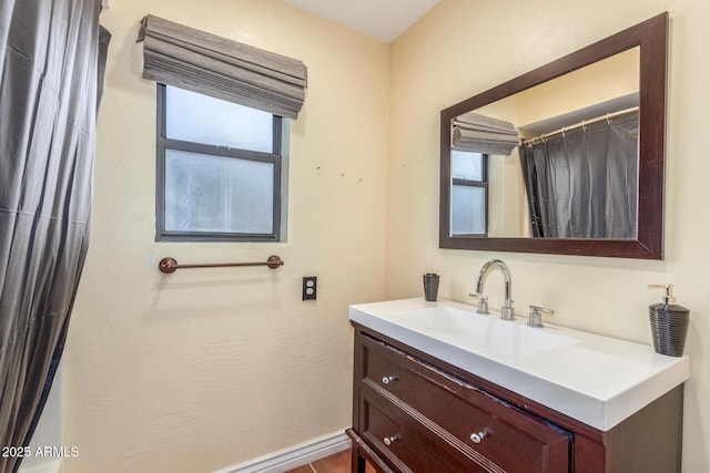 full bath featuring vanity and plenty of natural light