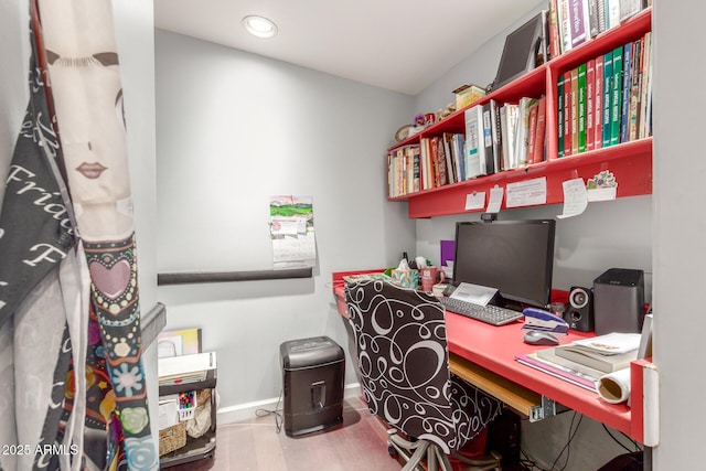 office featuring wood finished floors and baseboards