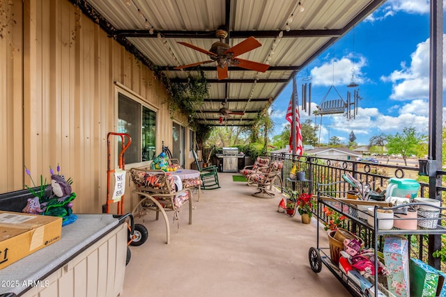 view of patio / terrace featuring ceiling fan