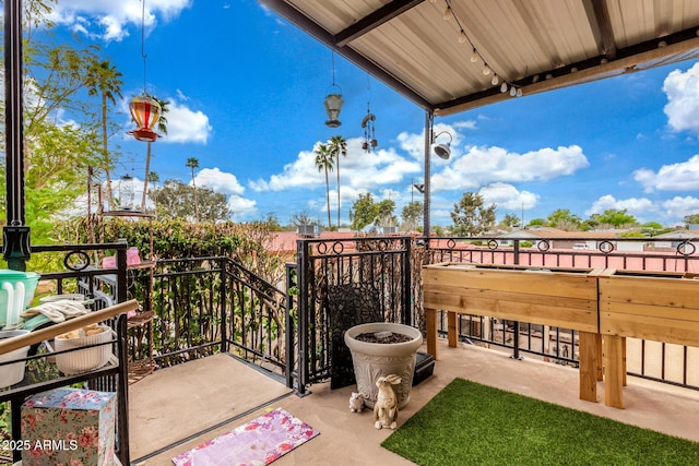 view of patio / terrace featuring a balcony and a sink