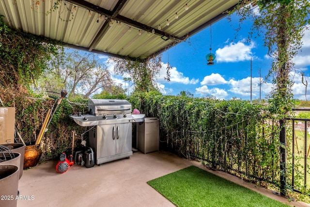 view of patio / terrace with fence and grilling area