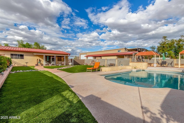 view of pool featuring a yard, a patio, a fenced in pool, and a fenced backyard