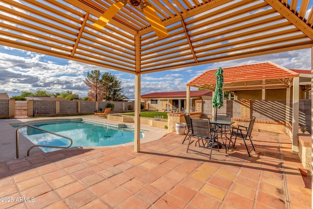 view of swimming pool with a patio area, a fenced backyard, outdoor dining space, and a pergola