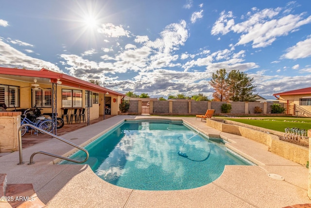 view of swimming pool with a fenced in pool, a fenced backyard, and a patio area