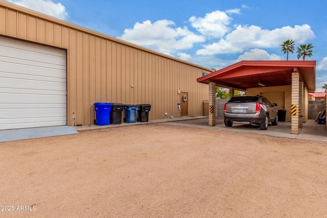 exterior space with an attached carport and driveway