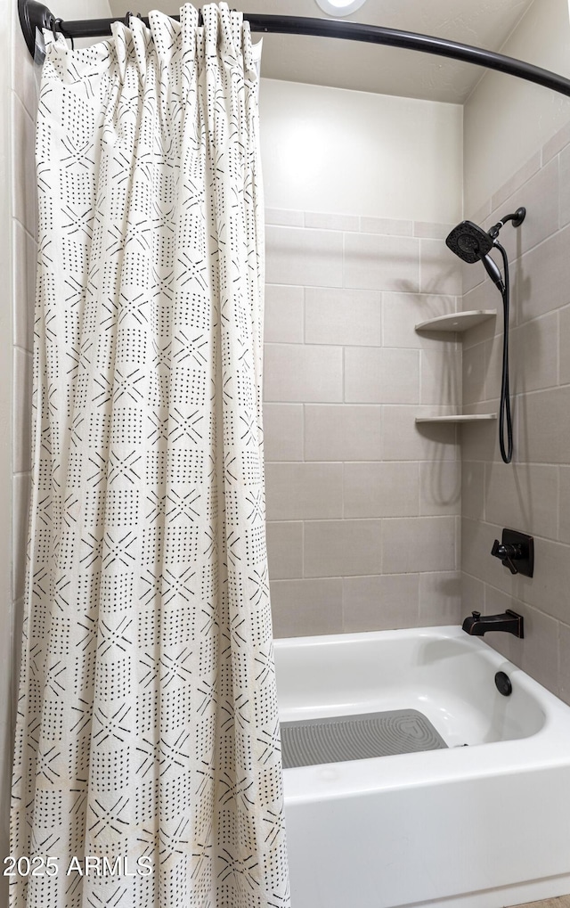 bathroom with shower / bathtub combination with curtain