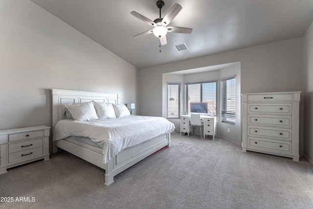 bedroom featuring vaulted ceiling, ceiling fan, and light colored carpet