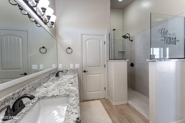 bathroom featuring vanity and a tile shower