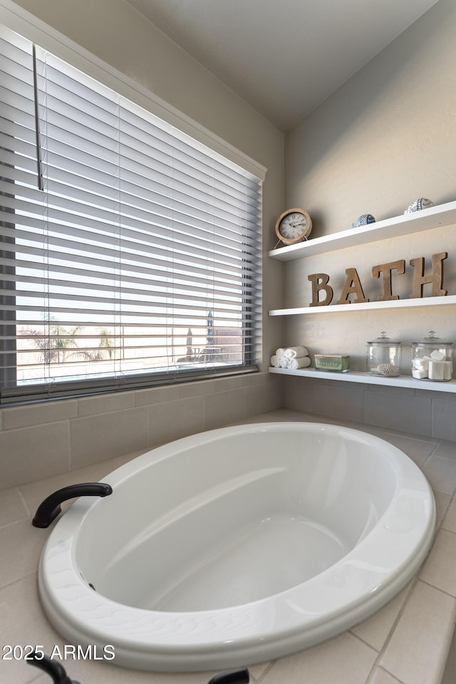 bathroom with tiled bath