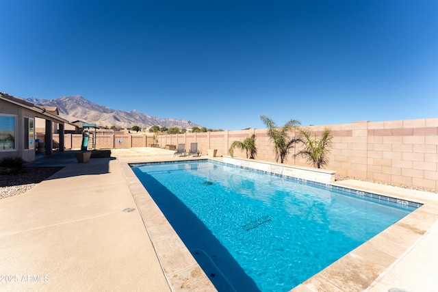 view of pool with a mountain view