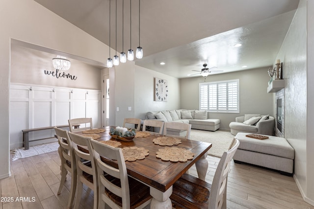 dining room with vaulted ceiling and ceiling fan