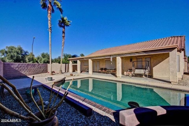 view of swimming pool with a patio