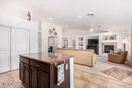 kitchen with dark brown cabinetry and a kitchen island