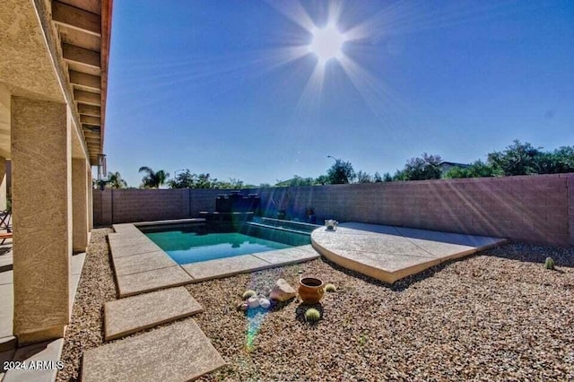 view of swimming pool featuring a patio area